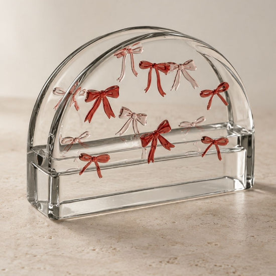 Porta-guardanapos Chérie em cristal transparente com laços rosa em relevo